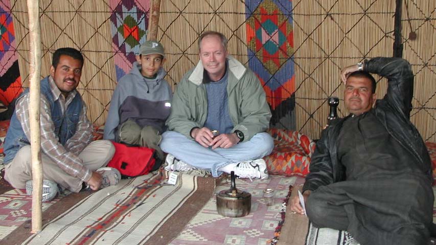 Tea in Palmyra, Syria.The kid is wearing my hat. Sweater by Asprey.