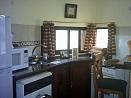 Peque�a cocina completamente equipada. cocina a gas heladera con freser, lavarropa