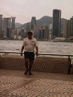 Me in Tsim Sha Tsui with Hong Kong Island in the background