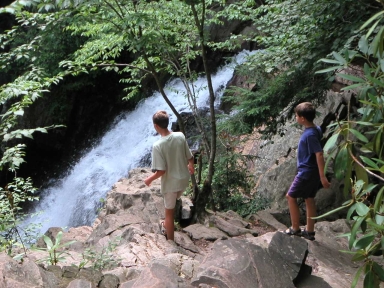 Boys at the waterfall