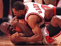 June 16, 1996: Teammate Randy Brown hugs Michael after winning the 1996 NBA finals against Seattle.