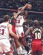 May 6, 1997: MJ jumps for the ball with Steve Smith of the Atlanta Hawks. 