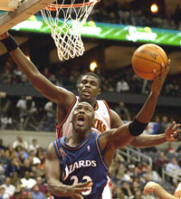 MJ drives past Atlanta Hawks center Nazr Mohammed for a basket during the second half in Atlanta. (AP) 