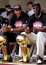 1998: MJ sits with Scottie Pippen and their NBA trophies. 
