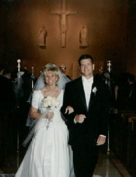 Mike and Mary walk out of the church following the ceremony!