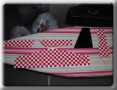Bottom of tail feathers, red/white checkerboard trim