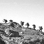 Wandering climbers on a ridge of Ben Mor in Scotland