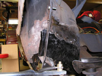 wheel well viewed from trunk area.  Not trimmed yet.