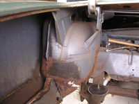 chopped out trunk near wheelwell