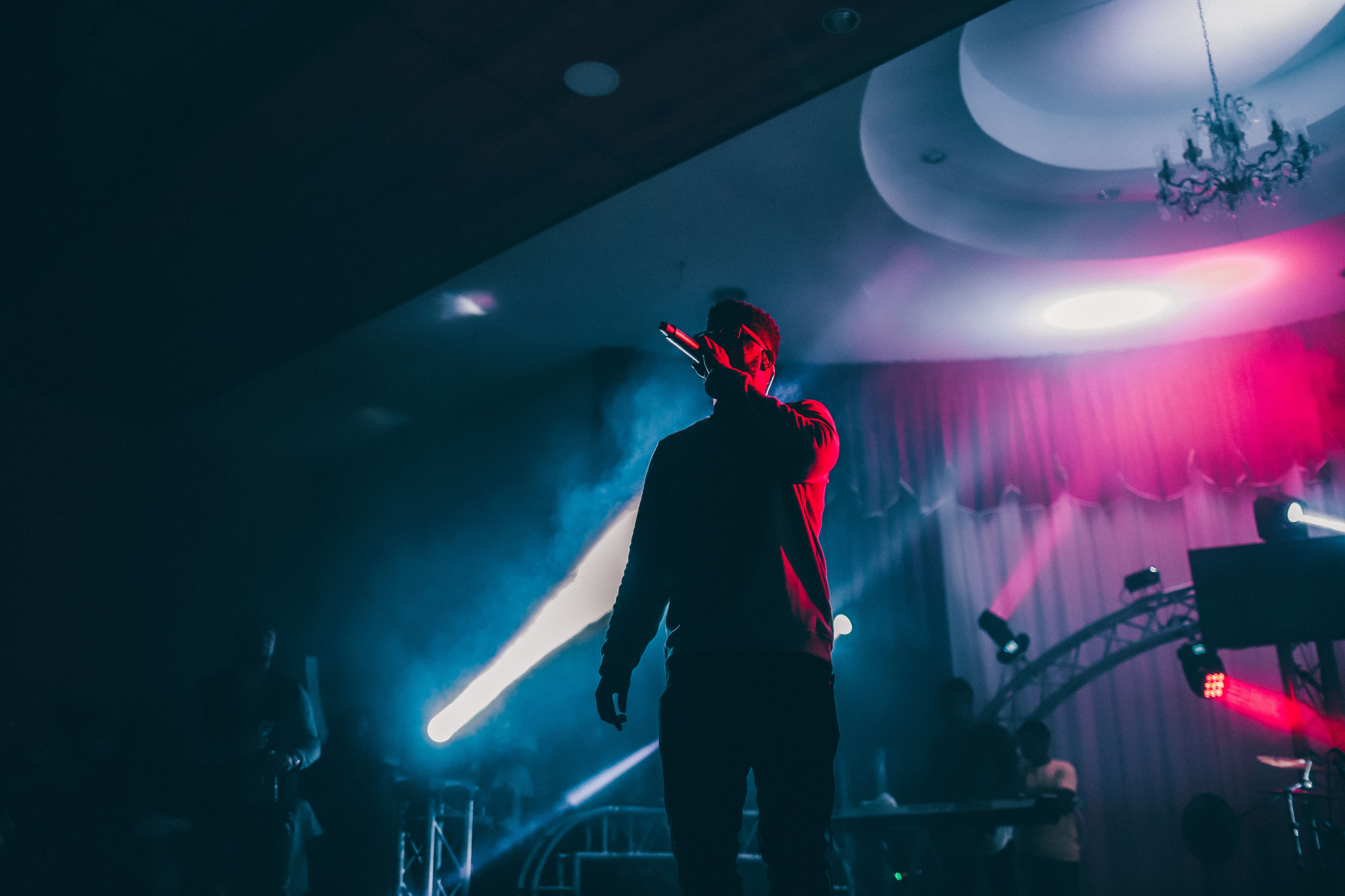 Man singing into a crowd