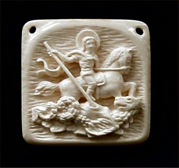 The microscopic bone Icon `Saint George Victorius and the Dragon` in Russian style.