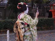 Traditional Maiko (Geisha In Training) With Not So Traditional Cell Phone