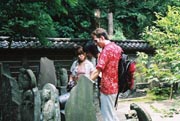 Youko, Yasuko and Christopher checking out some enshrined guys