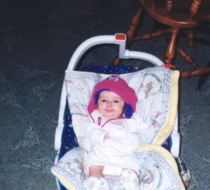 "Molly Christmas morning wearing her new hat."