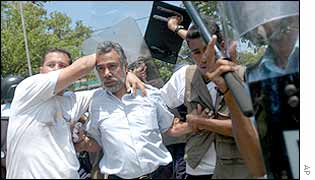 East Timor's President Xanana Gusmao (second from left) and civilian police 