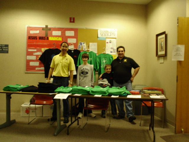 Winston Mina and DGK Bill Farfan receive help in manning the t-shirt table