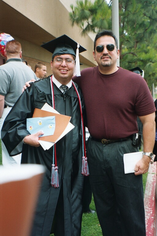 Grad day with my high school history teacher, Mr. Rojas.