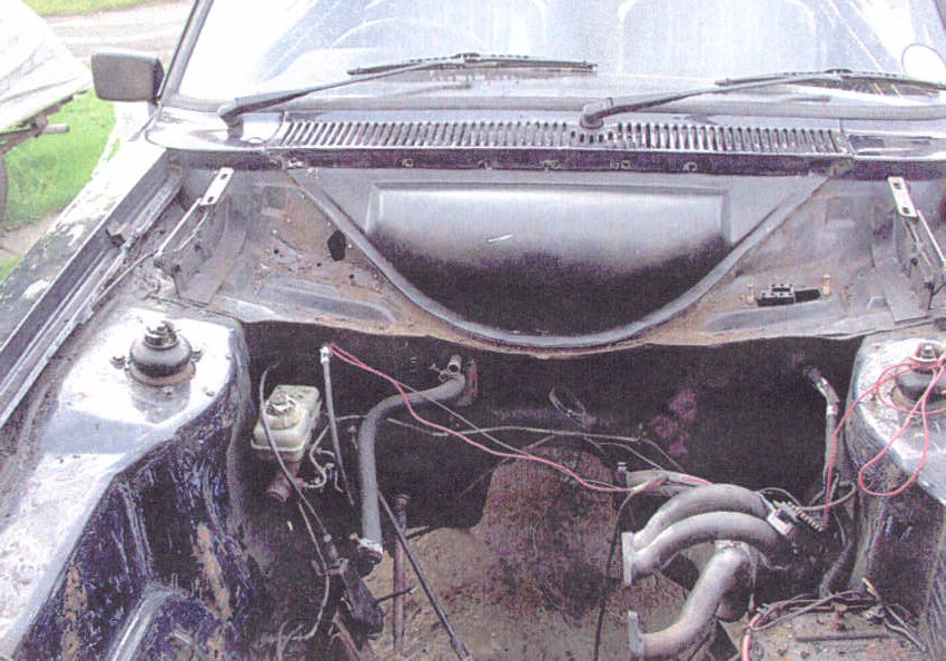 engine bay with new plenum being tested for fit-note the small hole found underneath a pop-riveted plate at the side of the plenum