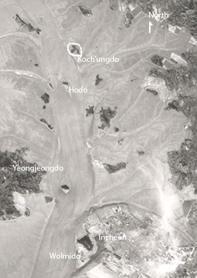 A 1968 CORONA spy-satellite photo of the area around Incheon, before the surrounding islands were reclaimed from the sea. Koch'umdo is circled.