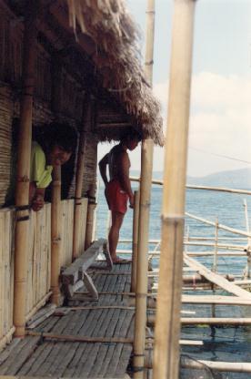 fish farmer at his house build over the water