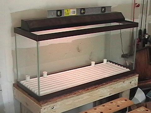The tank and temporary stand, sitting in the garage.