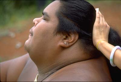 Israel 'IZ' Kamakawiwo`ole and his wife's, Marlene's, hand...