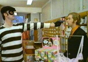 Criminal holding a gun
