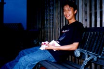 Here's Jun Jhen~ young.... sweet..... innocent.... forloan like children..... pure......#(%*#(%* IMMATURE INGENUOUS SICKO~!! j.k...~ well he just received his first gift.. from toby... a magnetic doll in a takeshimaya bag~!! hehehe~