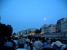on a cruise down the river through the heart of paris... with moon watching over us