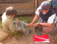 nurse Dorel� examines a patient whose house we happened upon . . .