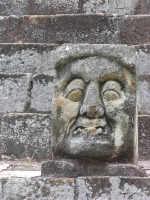 an ancient face at the Mayan ruins at Copn