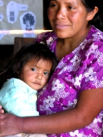 Maln, a young participant in a nutrition workshop, with her mom Magdalena