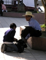 getting a shoe shine in the central plaza, Uspantn