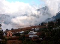 clouds float past the village of Tiquisislaj