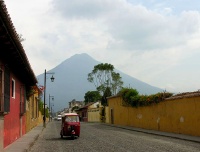 a taxi on a typical antig�e�a street: cobblestones, gas lamps,