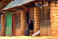 a shopkeeper in Santo Domingo Xe'en, outside her place of business