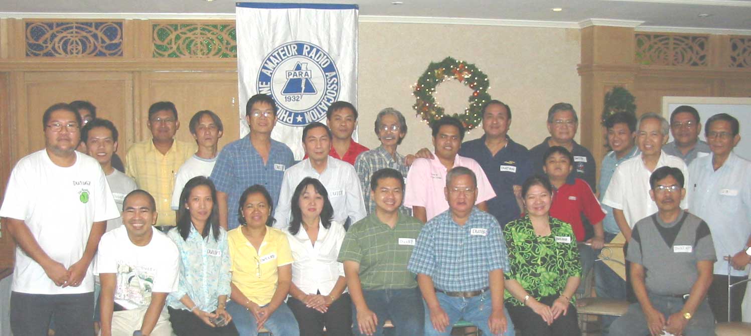 Just in front of PARA banner,Mon DU1FV in blue checkered shirt and Dick DU1DT in white shirt attending a District 1 Pow-wow