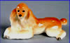 Recumbent poodles figurine