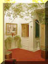 Bar Area - After:  We painted the bar walls the same pale yellow as the entry alcove which brightened it up and tied the two rooms together.