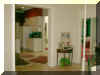 Entry room (and dining area)  leading to kitchen and entry alcove on the right