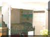 Guest Bedroom - After  Painted the walls a light peach and put in a mural of a beach scene. We still have to decorate the room
