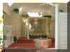 Master Bedroom - After: Subdued sesame color on the walls and the fountain give the room a tranquil garden look.