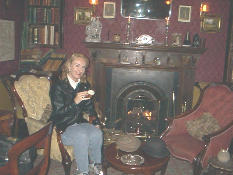 In Sherlock Holmes' study at 221B Baker Street London.  I'm holding his pipe.