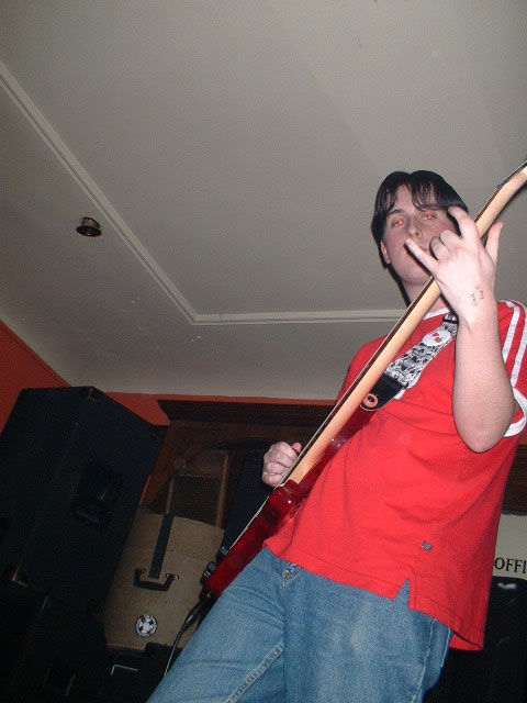 Glyn, i wish to point out i never pull that 'rawk' pose with my fingers, i just cant play bass too well, Written on my hand is check drop D, not that i dont have perfect pitch (giggles) i just like to know where D is! 