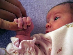 Pic, Peyten grabs Mom's finger.