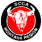 Montana SCCA Logo.  Black Wheel with red interior and an white face of a Steer Skull, Lettering in white says "SCCA Montana Region"