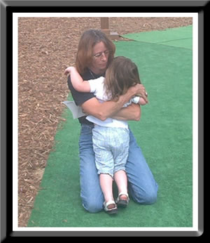 Granddaughter comforting me at the Traveling Wall