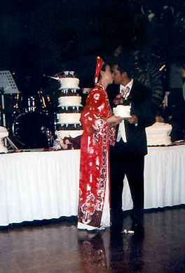 holding top layer of cake