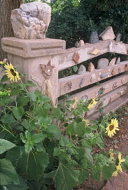 Sunflowers on folk art fence, Shaffer Hotel garden
