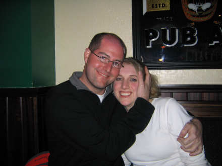 Is he covering her ears? or just squishing her head?